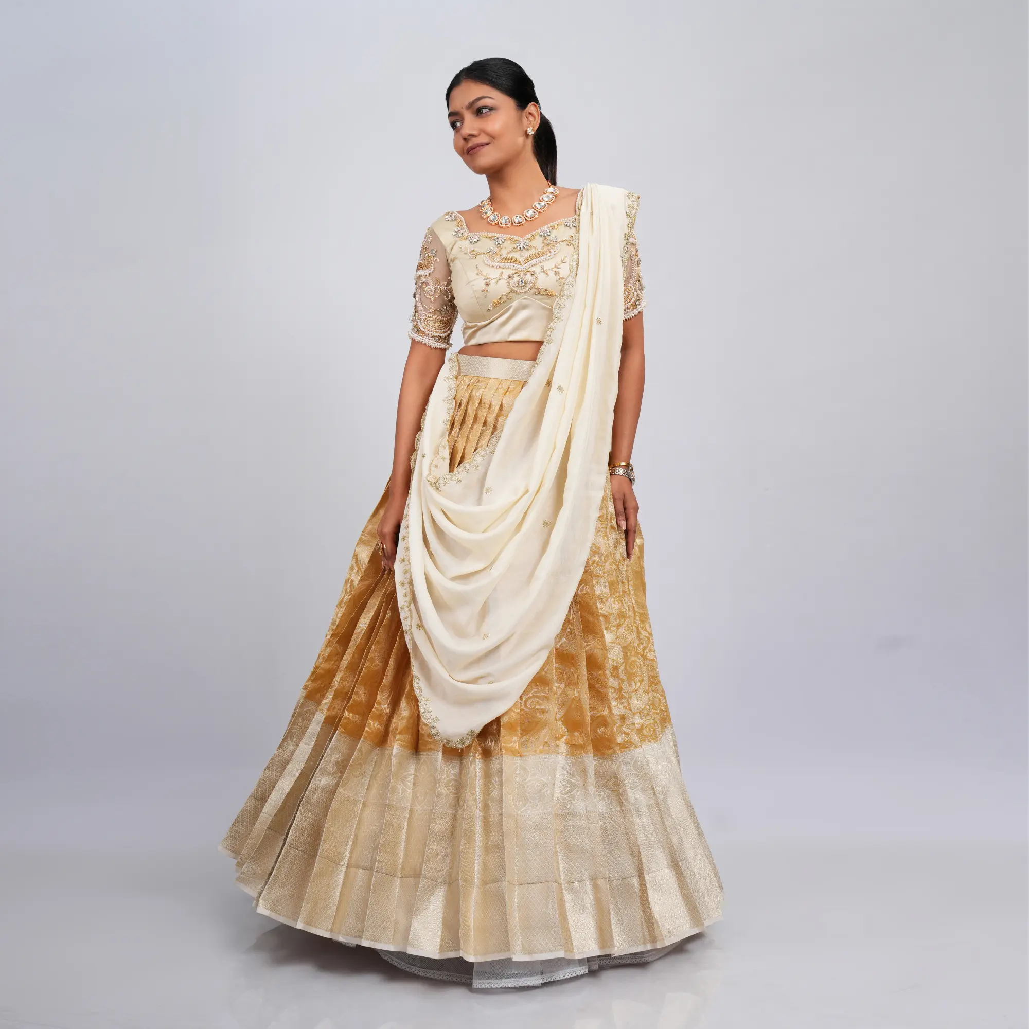gold and beige half saree
